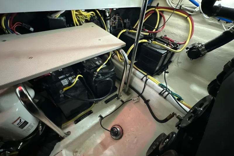 Slide: The Image of Engine compartment of 2021 Chaparral 347 SSX with batteries and wiring. - 63