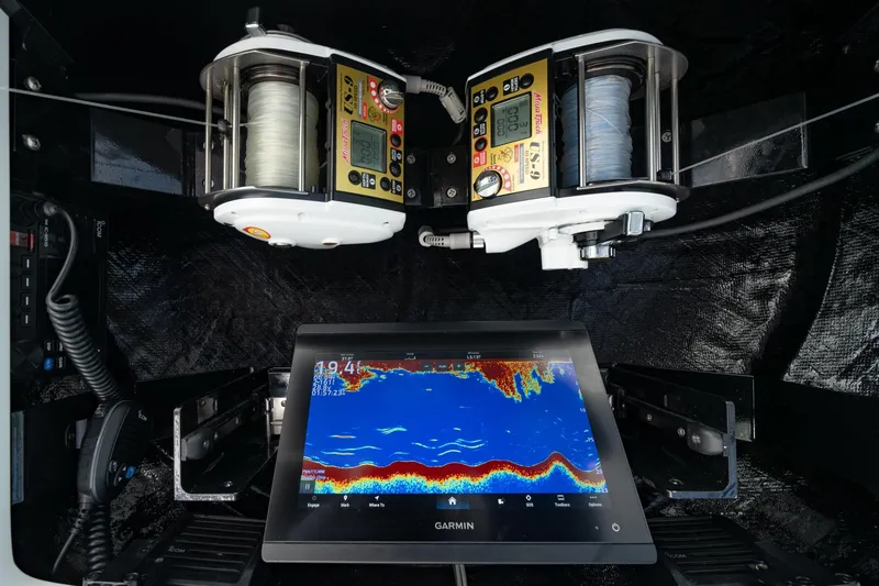 Slide: The Image of Fishing equipment and Garmin display on 2025 Viking 64 Convertible yacht. - 11