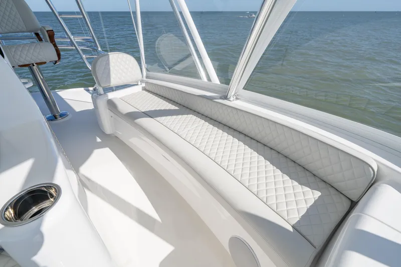 Slide: The Image of Luxurious seating on 2023 Viking 64 Convertible yacht with ocean view. - 14