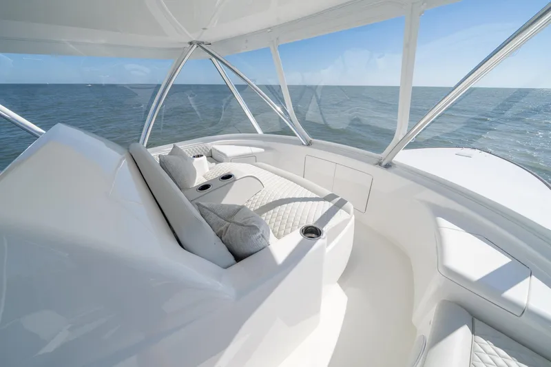 Slide: The Image of Luxurious interior of 2023 Viking 64 Convertible yacht with ocean view. - 16