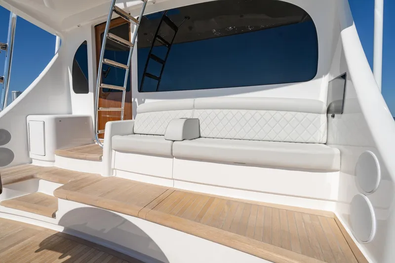Slide: The Image of 2023 Viking 64 Convertible yacht with elegant seating and sleek design. - 21