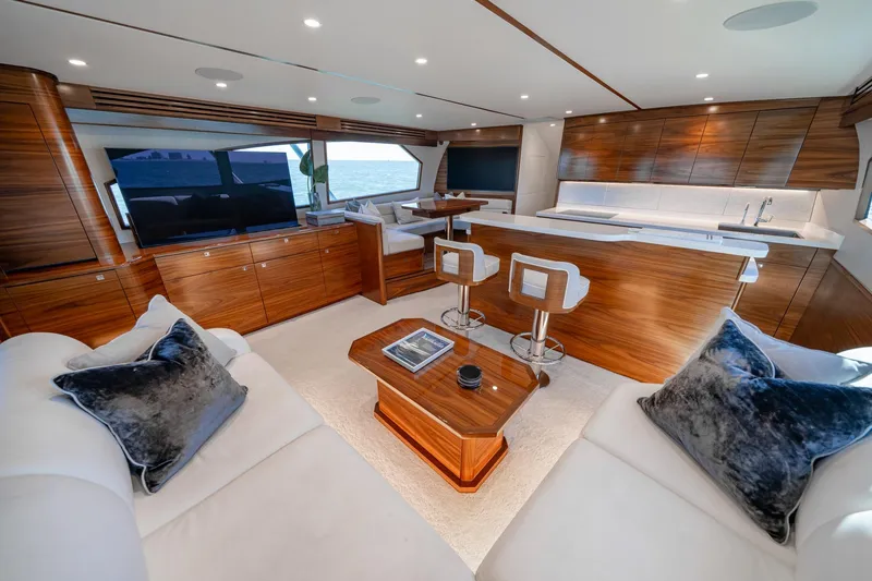 Slide: The Image of Luxurious interior of 2025 Viking 64 Convertible yacht with modern furnishings and elegant design. - 23