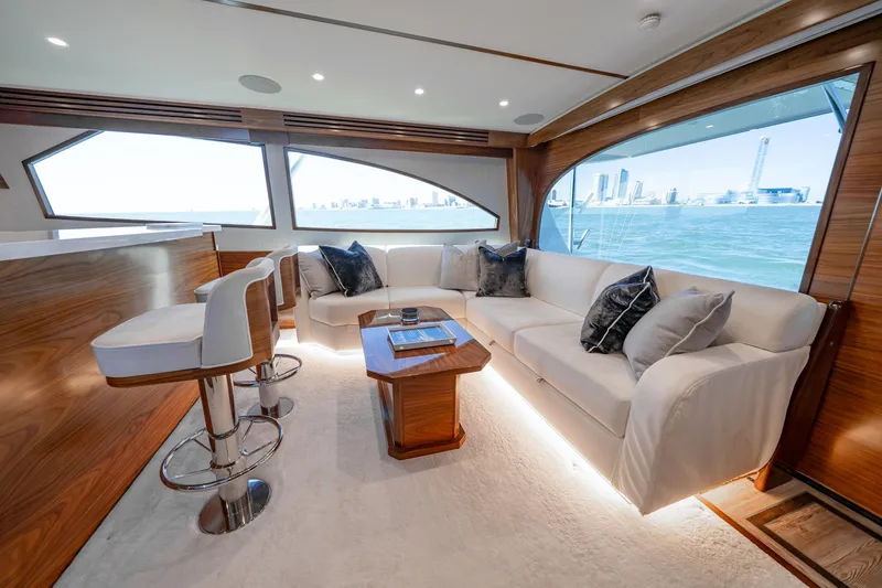 Slide: The Image of Luxurious interior of 2025 Viking 64 Convertible yacht with elegant seating and ocean view. - 27