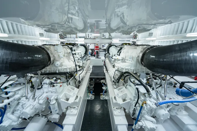 Slide: The Image of Engine room of 2023 Viking 64 Convertible yacht, showcasing powerful dual engines. - 41
