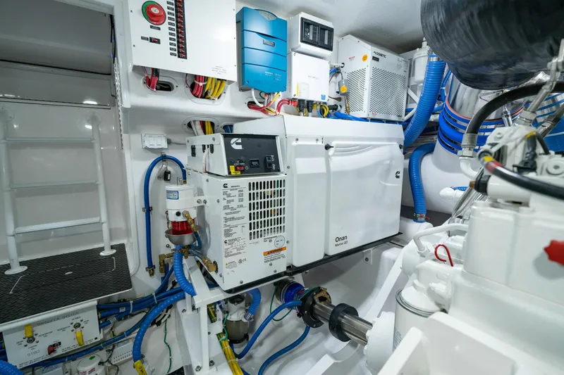 Slide: The Image of Engine room of 2023 Viking 64 Convertible yacht with advanced equipment and wiring. - 42