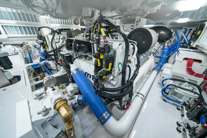 Slide: The Image of Engine room of 2025 Viking 64 Convertible yacht, showcasing advanced machinery and components. - 46