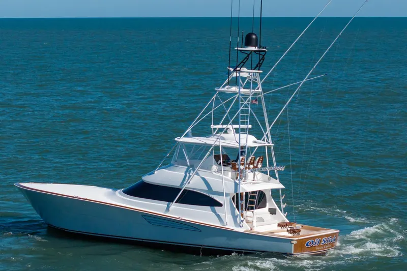 Slide: The Image of 2023 Viking 64 Convertible yacht cruising on open sea. - 5