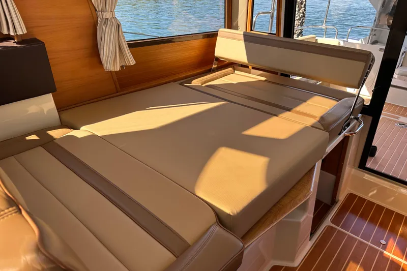 Slide: The Image of Interior of 2020 Ranger Tugs R-29 with beige seating and wooden accents. - 19