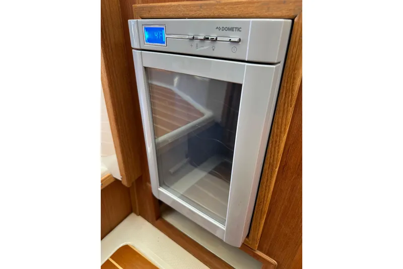 Slide: The Image of Dometic refrigerator in 2020 Ranger Tugs R-29 boat interior, wooden paneling. - 24