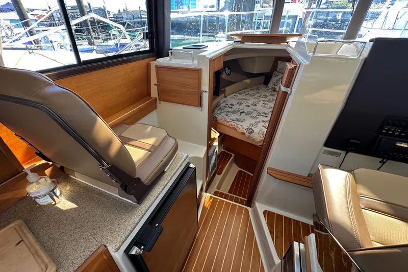 Slide: The Image of Interior of 2020 Ranger Tugs R-29 boat with seating and cabin view. - 30