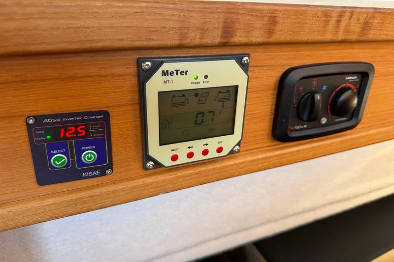 Slide: The Image of Control panel on 2020 Ranger Tugs R-29 with inverter charger and meter display. - 40