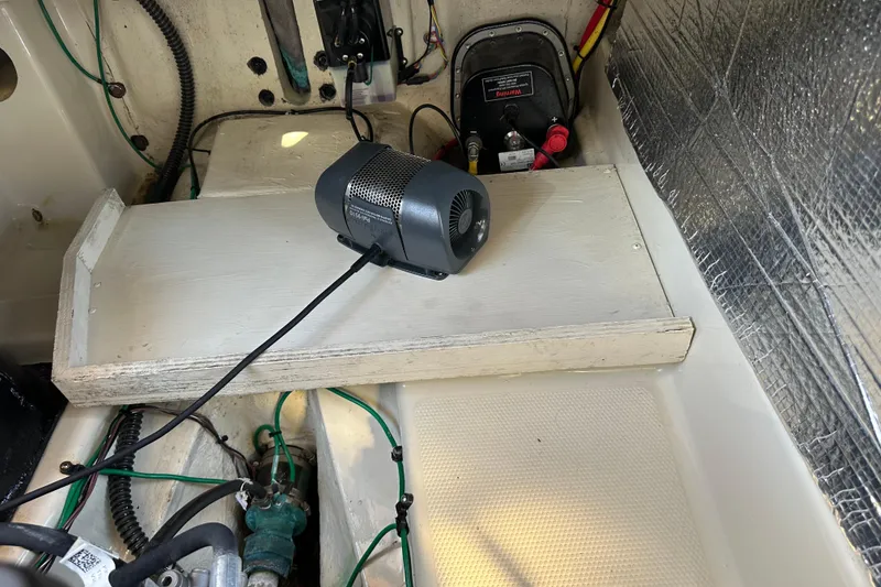 Slide: The Image of Engine compartment of 2020 Ranger Tugs R-29 with wiring and equipment. - 42