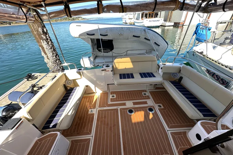 Slide: The Image of 2020 Ranger Tugs R-29 boat interior with spacious seating and elegant wood flooring. - 7