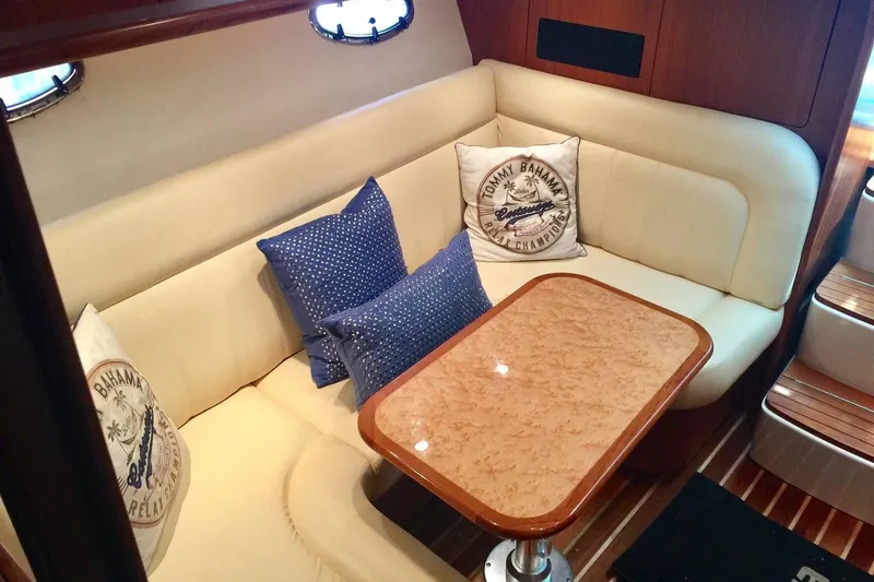 Slide: The Image of Luxurious interior of 2007 Tiara Yachts 3600 Open with plush seating and elegant table. - 13