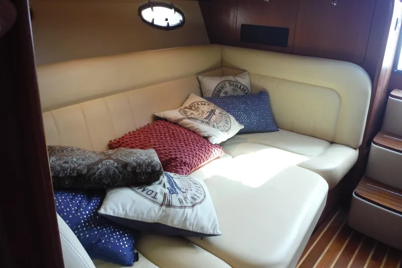 Slide: The Image of Interior of 2007 Tiara Yachts 3600 Open with cozy seating and decorative pillows. - 14