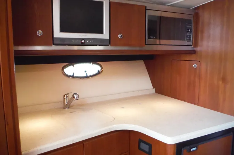 Slide: The Image of 2007 Tiara Yachts 3600 Open galley with TV, microwave, and sink. - 17