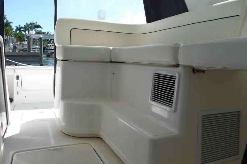Slide: The Image of 2007 Tiara Yachts 3600 Open interior seating area with white cushions and vent. - 31