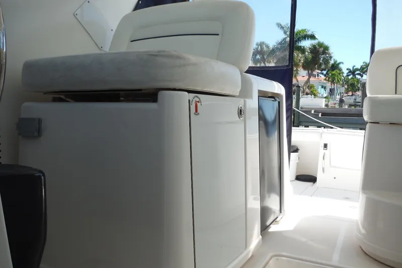 Slide: The Image of 2007 Tiara Yachts 3600 Open interior with seating and storage, dockside view. - 32