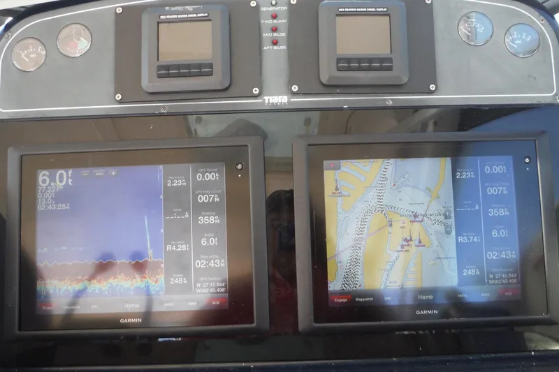 Slide: The Image of Dashboard of a 2007 Tiara Yachts 3600 Open with Garmin navigation displays. - 33