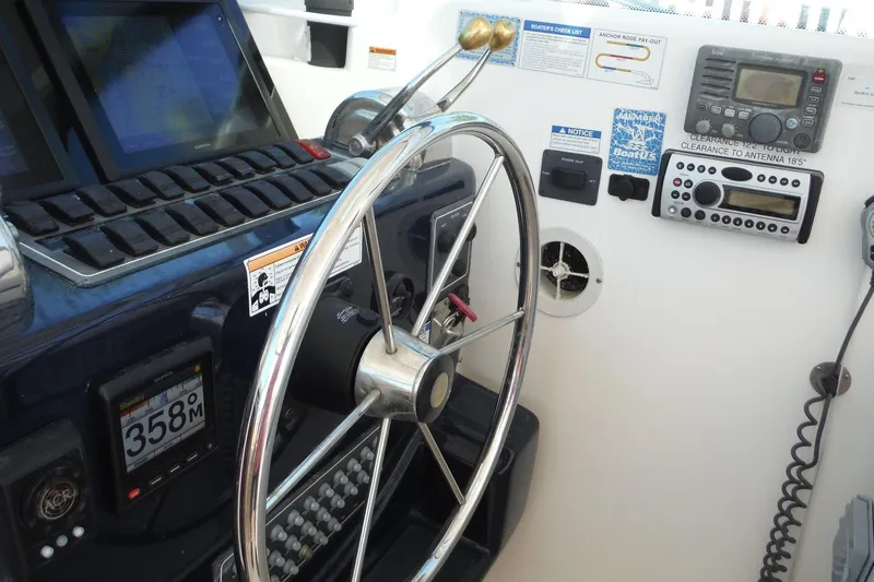 Slide: The Image of Helm of 2007 Tiara Yachts 3600 Open with navigation instruments and steering wheel. - 35