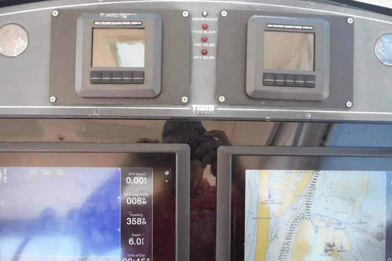 Slide: The Image of Dashboard of 2007 Tiara Yachts 3600 Open with navigation and engine displays. - 36