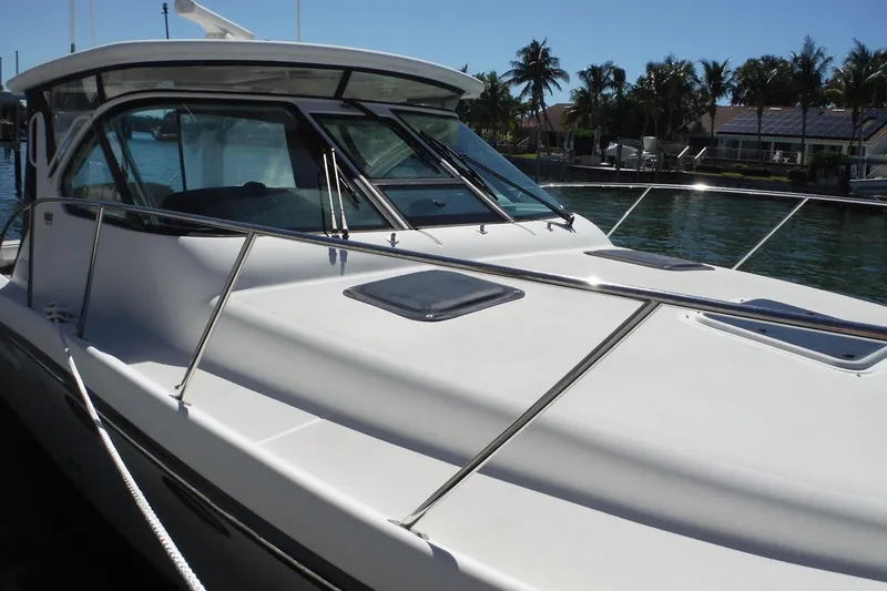 Slide: The Image of 2007 Tiara Yachts 3600 Open docked, featuring sleek design and spacious deck. - 5