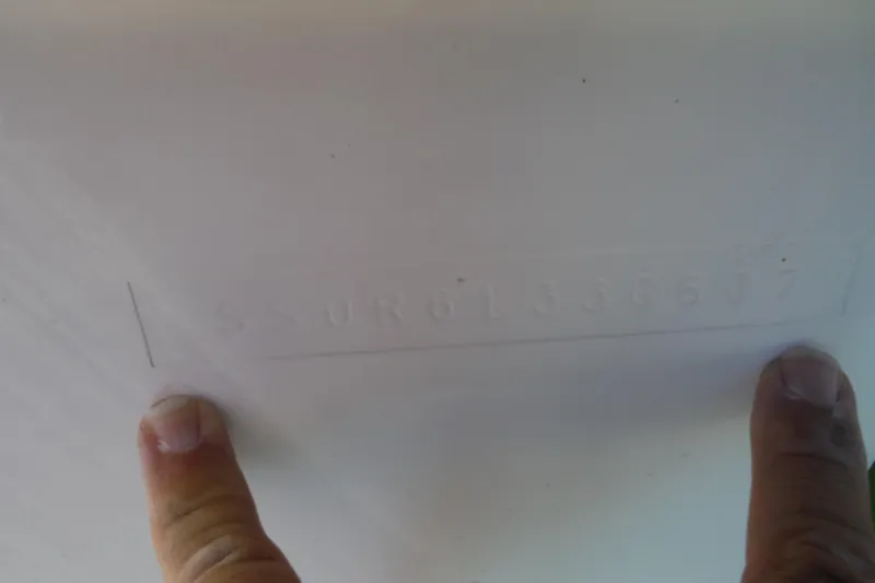 Slide: The Image of Hull identification number on 2007 Tiara Yachts 3600 Open, with fingers pointing. - 54