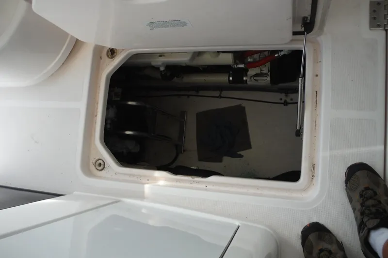 Slide: The Image of 2007 Tiara Yachts 3600 Open engine compartment with open hatch, showing interior details. - 55