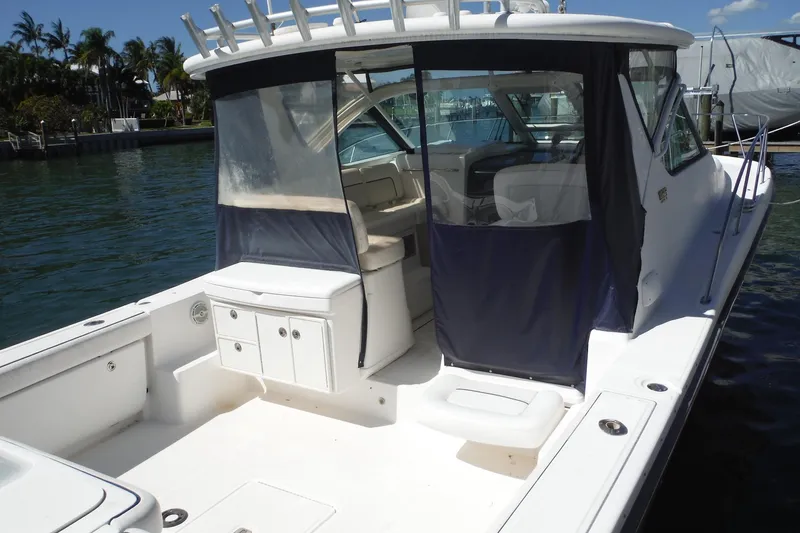 Slide: The Image of 2007 Tiara Yachts 3600 Open boat docked, featuring spacious deck and cabin area. - 6