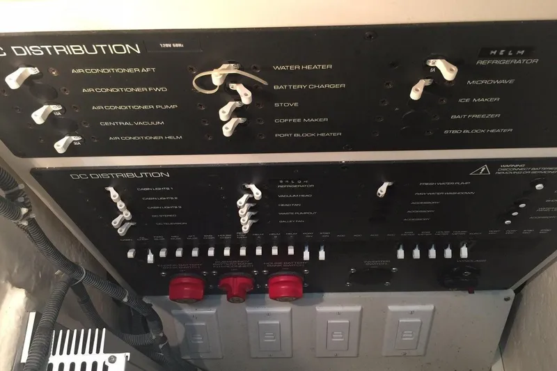 Slide: The Image of Electrical control panel on a 2007 Tiara Yachts 3600 Open, featuring AC and DC distribution. - 61