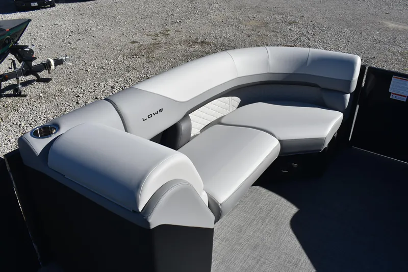 Slide: The Image of 2026 Lowe SS 230 WV boat interior with curved seating and cup holder. - 12