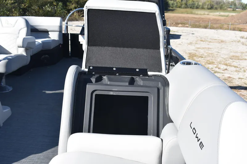 Slide: The Image of 2026 Lowe SS 230 WV boat interior with open storage compartment and seating. - 14