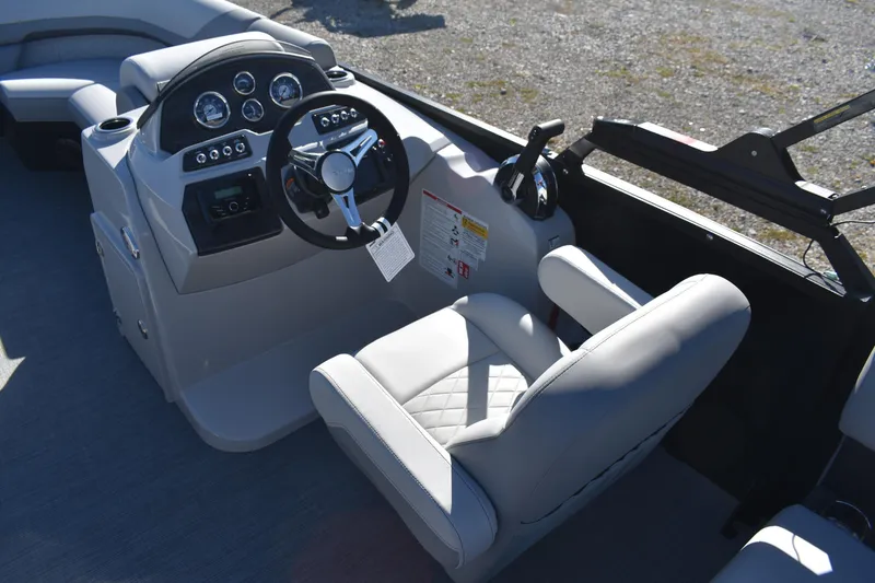 Slide: The Image of 2026 Lowe SS 230 WV boat cockpit with modern steering and controls. - 15