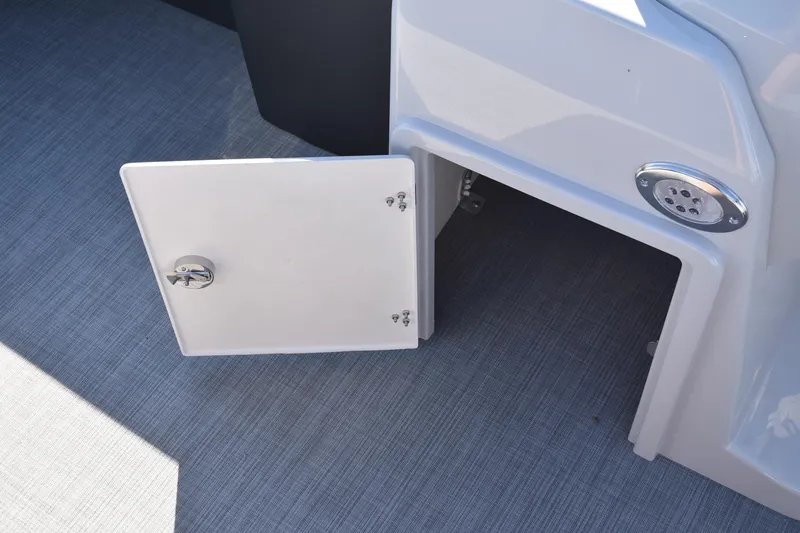 Slide: The Image of Open storage compartment on 2026 Lowe SS 230 WV boat, featuring a sleek design. - 18