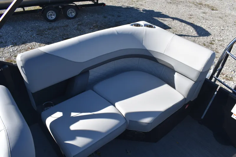 Slide: The Image of Luxurious seating on 2026 Lowe SS 230 WV boat, featuring sleek gray upholstery. - 19