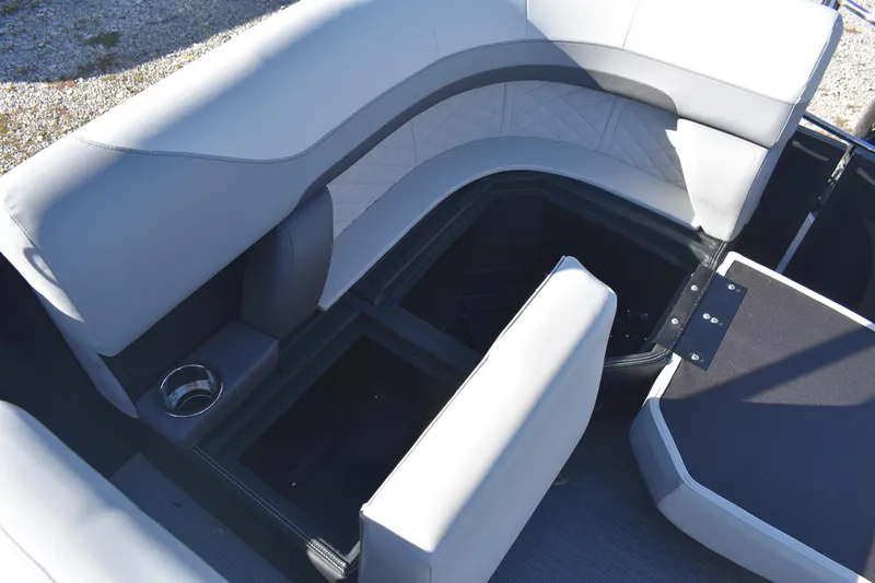 Slide: The Image of 2026 Lowe SS 230 WV boat interior with gray seating and storage compartments. - 20