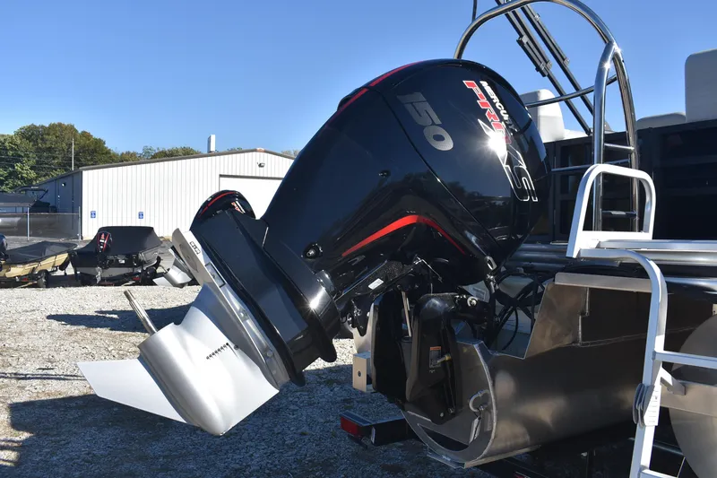 Slide: The Image of 2026 Lowe SS 230 WV boat with powerful Mercury 150 engine, parked outdoors. - 6