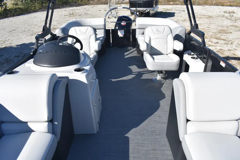 Slide: The Image of 2026 Lowe SS 230 WV pontoon boat interior with plush seating and modern helm. - 8