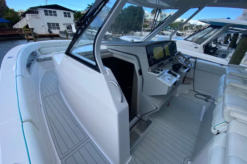 Slide: The Image of 2021 Regal 38 SAV boat interior with modern helm and spacious seating. - 19