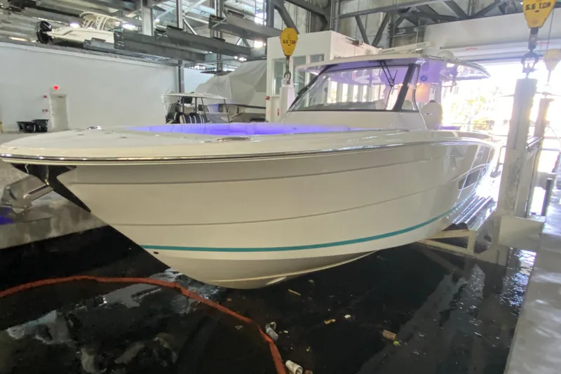 Slide: The Image of 2021 Regal 38 SAV boat in indoor storage, side view. - 2