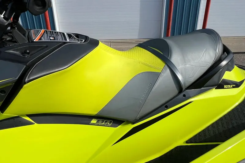 Slide: The Image of 2018 Sea-Doo RXP-X 300 jet ski, vibrant yellow and gray seat detail. - 13