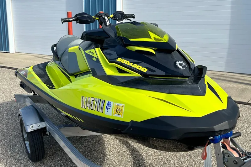 Slide: The Image of 2018 Sea-Doo RXP-X 300 jet ski in vibrant yellow on a trailer. - 3