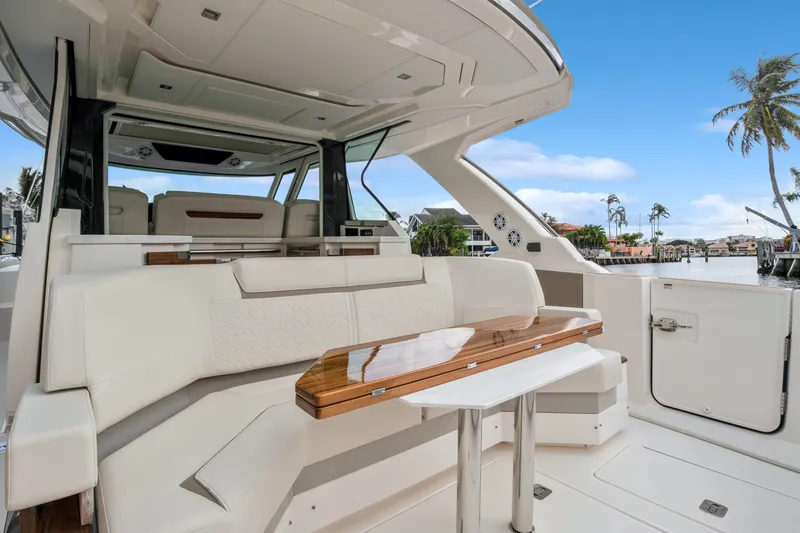 Slide: The Image of Luxurious 2022 Tiara Yachts 48 LS interior with elegant seating and wooden table. - 17