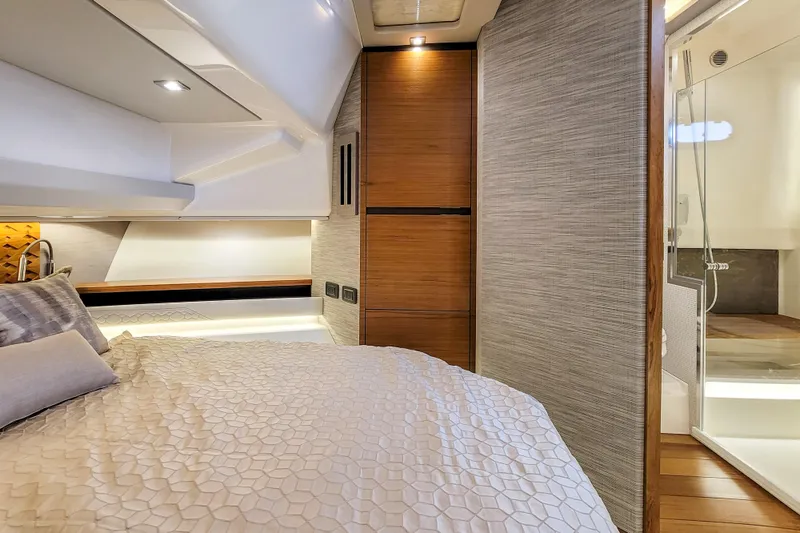 Slide: The Image of Luxurious interior of 2022 Tiara Yachts 48 LS, featuring a cozy bedroom and modern bathroom. - 23