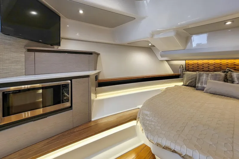 Slide: The Image of Luxurious interior of 2022 Tiara Yachts 48 LS with modern amenities and cozy bedding. - 24