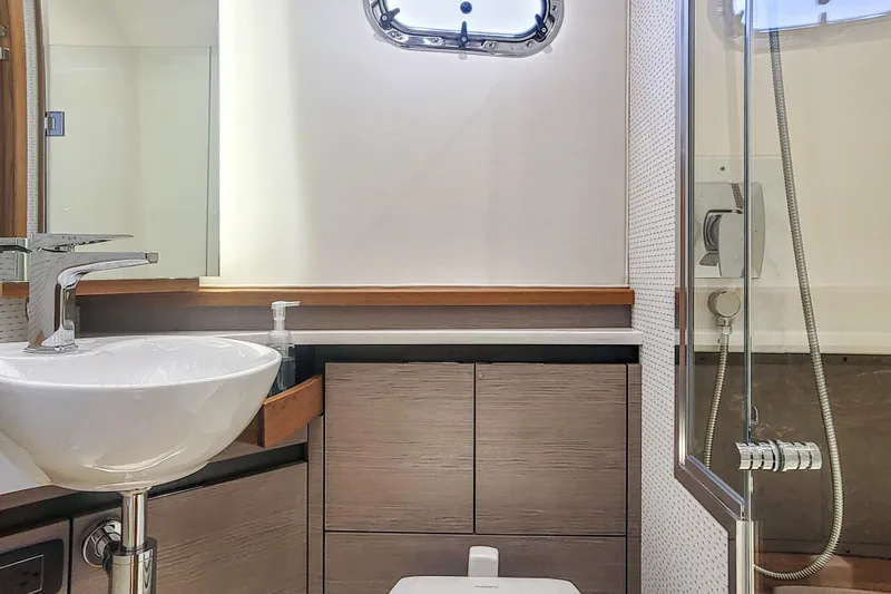 Slide: The Image of Luxurious bathroom interior of 2022 Tiara Yachts 48 LS with modern fixtures and shower. - 25