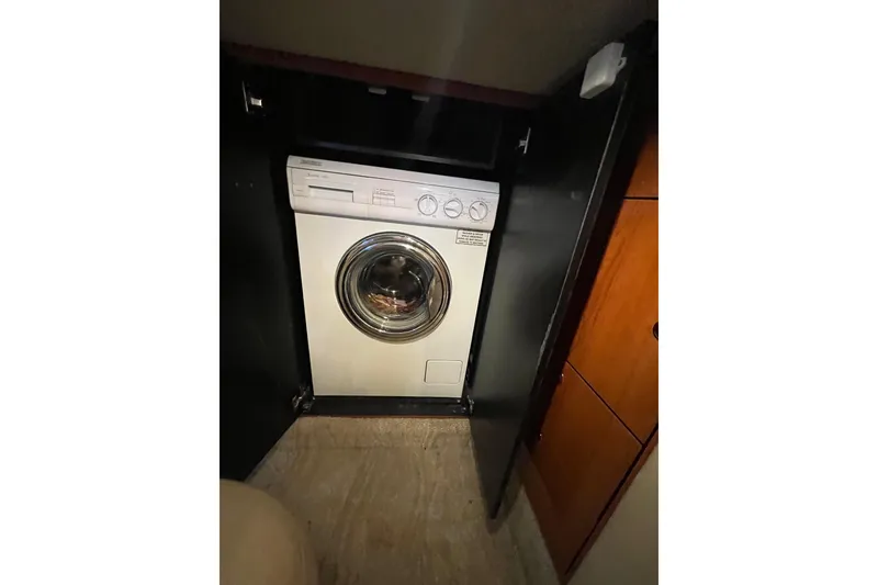 Slide: The Image of Washing machine inside 2000 Sea Ray 460 Sundancer yacht cabin. - 17