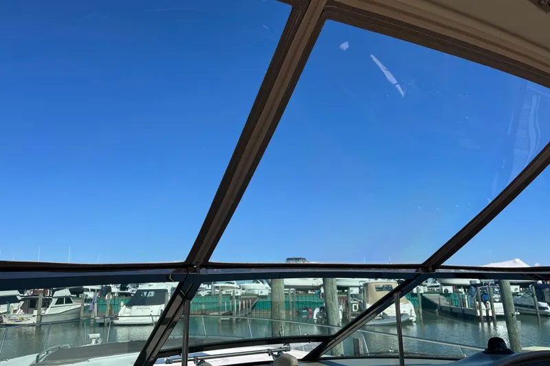 Slide: The Image of View from a 2000 Sea Ray 460 Sundancer yacht, overlooking a marina under clear blue skies. - 5