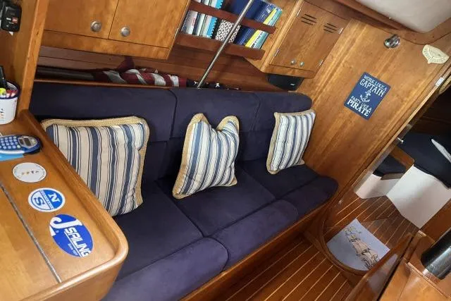 Slide: The Image of Interior of 2004 J Boats J/133 with cozy seating and nautical decor. - 2