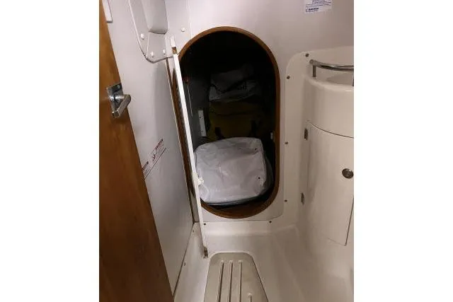 Slide: The Image of Interior storage compartment on a 2004 J Boats J/133 sailboat. - 22